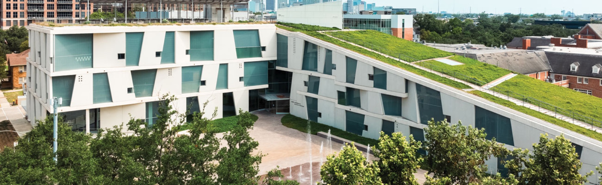 The Glassell School of Art building, whose angled windows inspired the poster geometry.